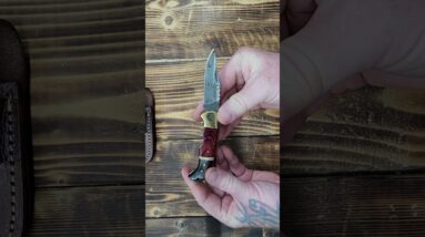 6.5 inch Damascus Folding Pocket Knife with Sheath  Black-Red Wood & Brass https://amzn.to/4iE7RjE